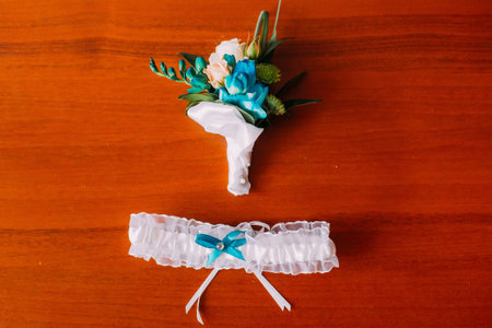Close-up of bride's wedding accessories isolated on wooden background.の写真素材