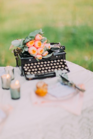 Wedding. In the area for photos are chairs , table with pink serving and a typewriter.の写真素材