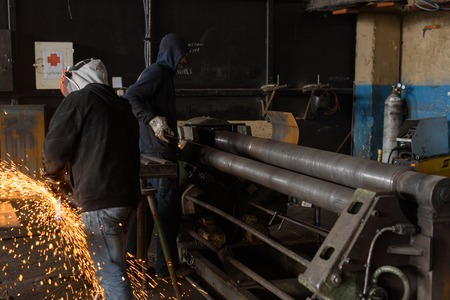 Man works with steel on the pressの写真素材