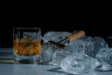 close up photo of equipment for the bar. Special knife for chopping ice, glass of whiskey/scotch,...