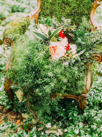 The above view on the colourful wedding bouquet placed on the moss chairの写真素材