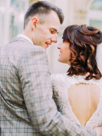 The close-up back view of the newlyweds` eye contact.の写真素材