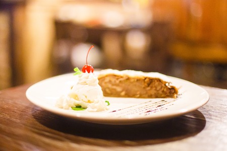 The delicious dessert consisted of ice cream and apple strudel. The side viewの写真素材