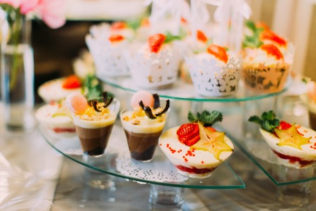 Close-up view of the delicious wedding desserts with chocolate and fruitsの写真素材