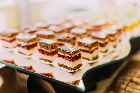 Wedding table set. The delicious chocolate cakes with strawberriesの写真素材