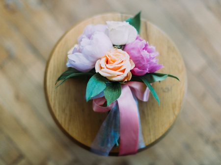 Close-up view of the beautiful boutonniere of colourful rosesの写真素材