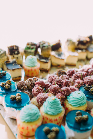 Close-up view of the wedding cupcakes with jelly decorated with fruitsの写真素材