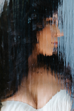 Look through the glass at brunette brideの写真素材