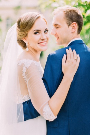Close-up view of the smiling newlywed couple.の写真素材