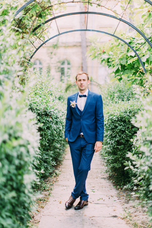Stylishle dressed groom in the garden.の写真素材
