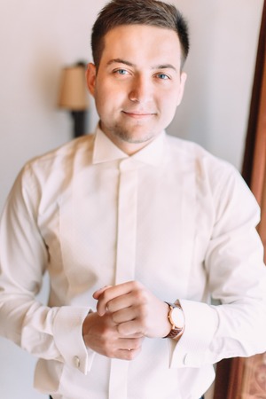 Handsome smiling groom. Half-length portrait.の写真素材