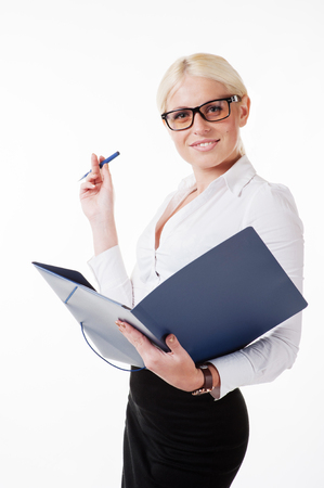 Business woman wearing glasses holding a folderの写真素材