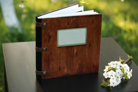 wooden photobook on the tableの写真素材
