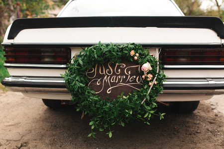 Beautiful wedding car with plate JUST MARRIEDの写真素材