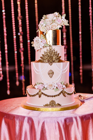 Closeup of white wedding cake with flowers. Wedding ceremony.