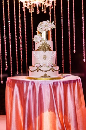 Closeup of white wedding cake with flowers. Wedding ceremony.の写真素材