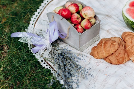 fresh croissants. tablecloth in the nature with food. lavender flowersの写真素材
