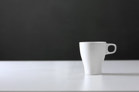 White cup on gray background