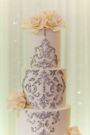 White wedding cake with flowers and blueberries. Vintage style for weddings, birthdays.の写真素材