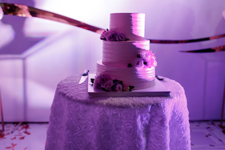pinkwedding cake with flowers and blueberries on the table. Vintage style for weddings, birthdays.の写真素材