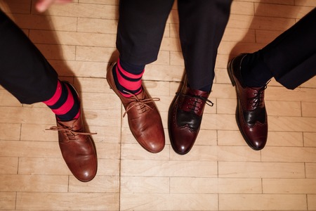 Men's feet in stylish shoes and funny socks. male styleの写真素材
