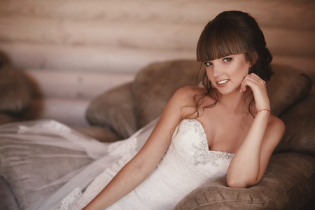 Portrait of a beautiful young woman. Makeup and hairstyle in bride. Close up. Wedding morning. Gentle, Tender emotion on the face.の写真素材