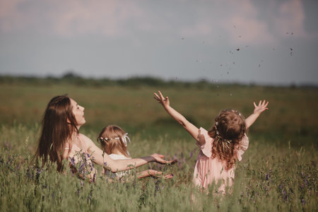 Beautiful Mother And her little daughter outdoors. Nature. Beauty Mum and her Child playing in Park...