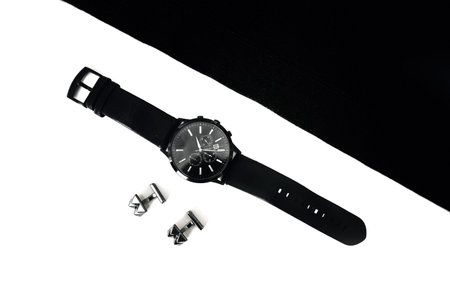 watches and cufflinks on the table, black and white