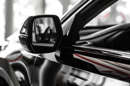 side rear-view mirror on a car. rear view mirror. Focus to mirror view