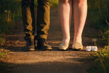 Cropped image of romantic couple is on a walk in the park. Beautiful young woman and handsome man...