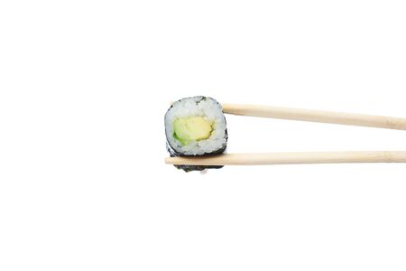 fresh vegetarian maki sushi roll with wooden chopsticks isolated on white backgroundの写真素材