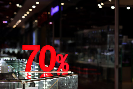 Season sale, black friday and shopping concept. Discounts in the shopping mall. Sale sign with Red...