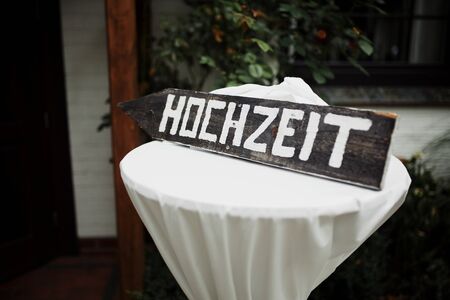 Wedding decor. Wooden board with inscription on German Wedding. Wedding decorations.の写真素材