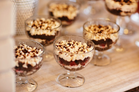 tiramisu desserts in a glass dessert bowl on table on party.