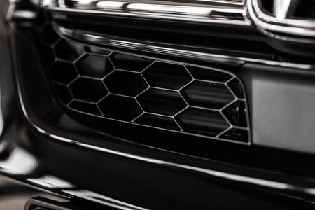Grid of white sports car. The radiator grille. Metal texture. chrome grille of a big powerful. Front of the car. Radiator grill of luxury sports car. Plastic or metal grill. radiator grillの写真素材