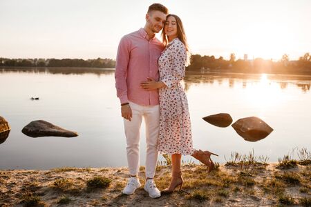 Closeup of happy loving couple spending leisure time together at beach. couple in love by the water. warm summer dayの写真素材