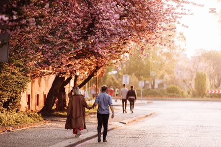 young modern stylish couple urban city outdoors. stylish young couple walking in the city. selective...