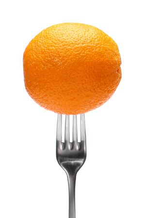 close up of fresh orange fruit on a fork on white background weight loss diet healthy food concept.の写真素材