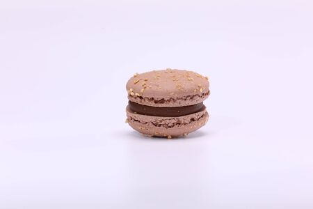 One cake of chocolate macaron or macaroon. Delicious macaroon isolated on white background. French sweet cookieの写真素材