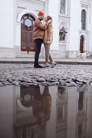 in love stylish young couple kissing in the city. Fashion outdoor sensual romantic portrait of beautiful young couple hugs and kissing on the city. selective focusの写真素材