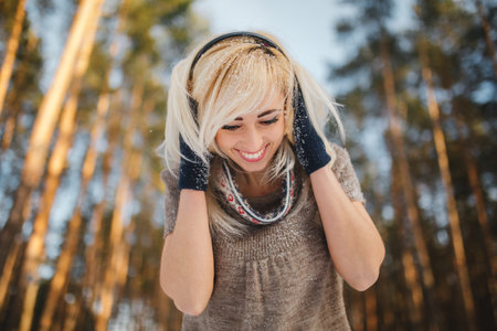 portrait of a beautiful girl in a snowy forest.woman in winter park. soft focus