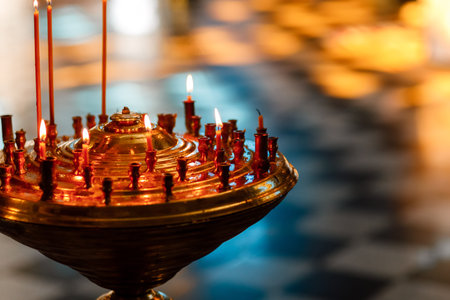 Many burning wax candles in the orthodox church. selective focus.