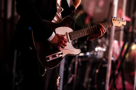 close up of hands playing an bass.の写真素材