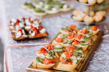Snack. Bruschetta with salmon, avocado and microgreen sprouts on a wooden plate.