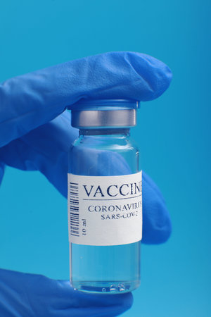 Development and creation of a coronavirus vaccine COVID-19. Coronavirus Vaccine in glass bottle in...