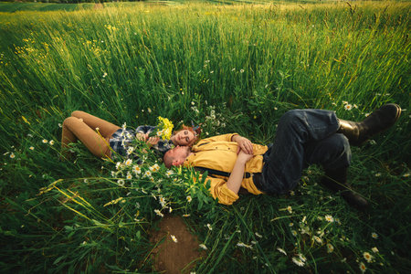 Playful happy handsome couple having while walking in woods. tourists in the mountains. Adventure in...