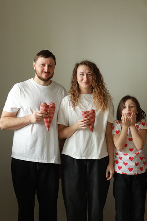 Young mom, dad with daughter traveling. parent playing and running with child outdoors, family trip in mountains. Active summer holidays. mothers, fathers and baby's day concept.の写真素材