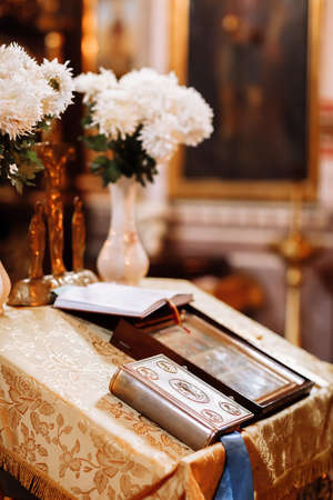 orthodox church interior with bible and icon. wedding ceremony.の写真素材