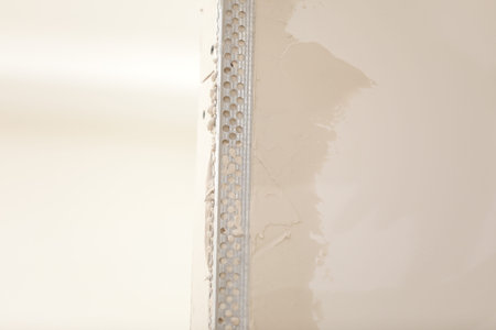 The worker set the metal wall profile in the new flat. Plasterboard metal profiles. Gypsum board...