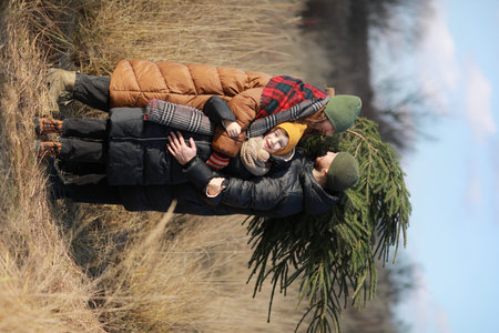 happy family mother father and child daughter prepare for Halloween decorate the home with pumpkins and making jack, laughing and play.の写真素材